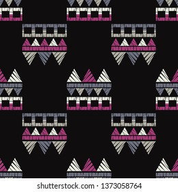 Ethnic boho seamless pattern. Embroidery on fabric. Patchwork texture. Weaving. Traditional ornament. Tribal pattern. Folk motif. Can be used for wallpaper, textile, invitation card, wrapping, web.