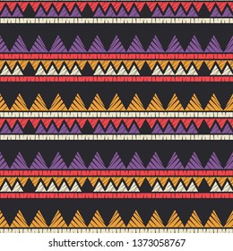 Ethnic boho seamless pattern. Embroidery on fabric. Patchwork texture. Weaving. Traditional ornament. Tribal pattern. Folk motif. Can be used for wallpaper, textile, invitation card, wrapping, web.
