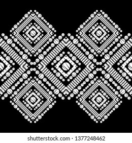 Ethnic boho seamless pattern. Embroidery on fabric. Patchwork texture. Weaving. Traditional ornament. Tribal pattern. Folk motif. Can be used for wallpaper, textile, invitation card, wrapping, web.