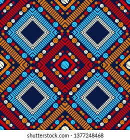 Ethnic boho seamless pattern. Embroidery on fabric. Patchwork texture. Weaving. Traditional ornament. Tribal pattern. Folk motif. Can be used for wallpaper, textile, invitation card, wrapping, web.