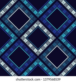 Ethnic boho seamless pattern. Embroidery on fabric. Patchwork texture. Weaving. Traditional ornament. Tribal pattern. Folk motif. Can be used for wallpaper, textile, invitation card, wrapping, web.