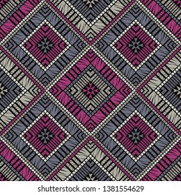 Ethnic boho seamless pattern. Embroidery on fabric. Patchwork texture. Weaving. Traditional ornament. Tribal pattern. Folk motif. Can be used for wallpaper, textile, invitation card, wrapping, web.