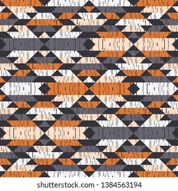 Ethnic boho seamless pattern. Embroidery on fabric. Patchwork texture. Weaving. Traditional ornament. Tribal pattern. Folk motif. Can be used for wallpaper, textile, invitation card, wrapping, web.
