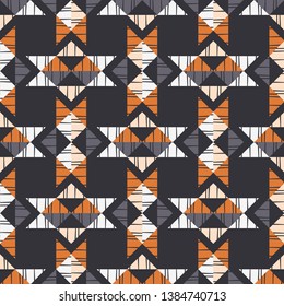 Ethnic boho seamless pattern. Embroidery on fabric. Patchwork texture. Weaving. Traditional ornament. Tribal pattern. Folk motif. Can be used for wallpaper, textile, invitation card, wrapping, web.