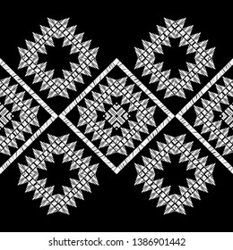 Ethnic boho seamless pattern. Embroidery on fabric. Patchwork texture. Weaving. Traditional ornament. Tribal pattern. Folk motif. Can be used for wallpaper, textile, invitation card, wrapping, web.
