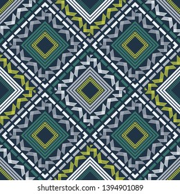 Ethnic boho seamless pattern. Embroidery on fabric. Patchwork texture. Weaving. Traditional ornament. Tribal pattern. Folk motif. Can be used for wallpaper, textile, invitation card, wrapping, web.