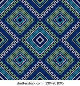 Ethnic boho seamless pattern. Embroidery on fabric. Patchwork texture. Weaving. Traditional ornament. Tribal pattern. Folk motif. Can be used for wallpaper, textile, invitation card, wrapping, web.