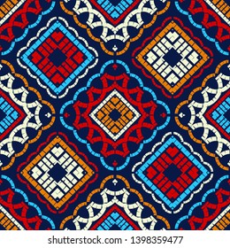Ethnic boho seamless pattern. Embroidery on fabric. Patchwork texture. Weaving. Traditional ornament. Tribal pattern. Folk motif. Can be used for wallpaper, textile, invitation card, wrapping, web.