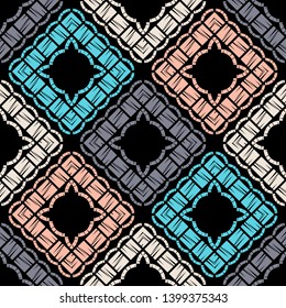 Ethnic boho seamless pattern. Embroidery on fabric. Patchwork texture. Weaving. Traditional ornament. Tribal pattern. Folk motif. Can be used for wallpaper, textile, invitation card, wrapping, web.