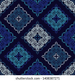 Ethnic boho seamless pattern. Embroidery on fabric. Patchwork texture. Weaving. Traditional ornament. Tribal pattern. Folk motif. Can be used for wallpaper, textile, wrapping, web.