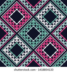 Ethnic boho seamless pattern. Embroidery on fabric. Patchwork texture. Weaving. Traditional ornament. Tribal pattern. Folk motif. Can be used for wallpaper, textile, wrapping, web.