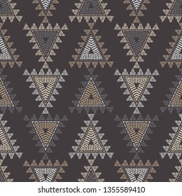Ethnic boho seamless pattern. Mosaic of triangles. Patchwork texture. Weaving. Traditional ornament. Tribal pattern. Folk motif. Can be used for wallpaper, textile, invitation card, wrapping, web.
