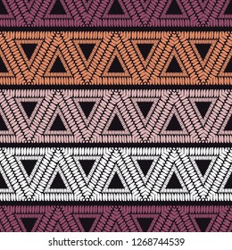 Ethnic boho seamless pattern. Triangles. Shapes from strips of hand shading. Traditional ornament. Tribal pattern. Folk motif. Can be used for wallpaper, textile, invitation card, web page background.