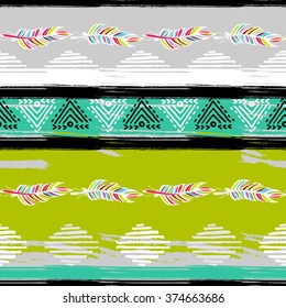 Ethnic brush stroke semless pattern with fearthers and geometric elements.