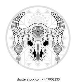 Ethnic bull skull on shaman drum background. Boho chic style.