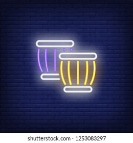 Ethnic drums neon sign. Summer and vacation design. Night bright neon sign, colorful billboard, light banner. Vector illustration in neon style.