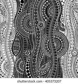 Ethnic floral zentangle, doodle background pattern in vector. Henna paisley mehndi doodles design tribal design element. Black and white pattern for coloring book for adults and kids.