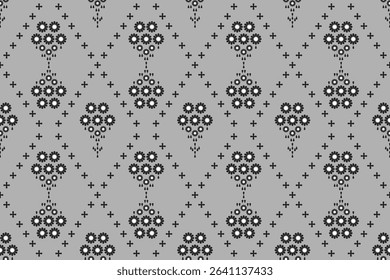 Ethnic flower patterns of black geometric shape on grey background. Textile seamless vector design. Concept of floral, motifs, tribal, vintage, tradition for wallpaper, embroidery, wrap, decor, fabric