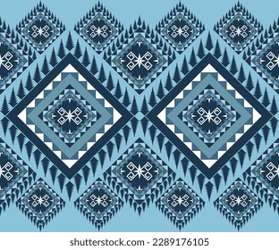 Patrón geométrico e ininterrumpido étnico en tono azul en el diseño de ilustración vectorial para tela, alfombra, pañuelo, papel de envoltura, azulejos y más