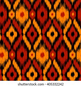 Ethnic folk tribal seamless pattern Ikat Ogee, consisting of orange, red and black elements