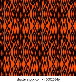 Ethnic folk tribal seamless pattern Ikat Ogee, consisting of orange, red and black elements