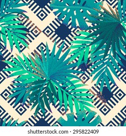 Ethnic geometric ornamental background with palm leaves. Tropical retro vector seamless pattern