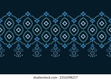 Ethnic geometric seamless fabric pattern Cross Stitch.Ikat embroidery oriental Pixel pattern blue background. Abstract,vector,illustration. Texture,Cross Stitch,scarf,decoration,motifs,wallpaper.