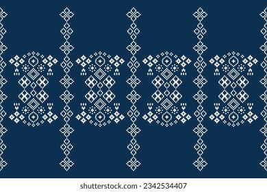 Ethnic geometric seamless fabric pattern Cross Stitch.Ikat embroidery oriental Pixel pattern blue background. Abstract,vector,illustration. Texture,Cross Stitch,frame,decoration,motifs,wallpaper.