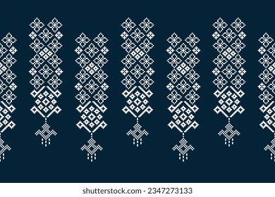 Ethnic geometric seamless fabric pattern Cross Stitch.Ikat embroidery oriental Pixel pattern blue background. Abstract,vector,illustration. Texture,Cross Stitch,frame,decoration,motifs,wallpaper.