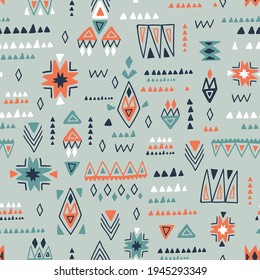 Ethnic geometrical seamless pattern. Hand-drawn shapes on the light grey background. Vector repeat abstract pattern for fabric design.
