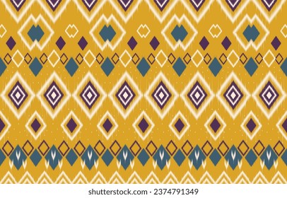 Ethnic Ikat abstract yellow. Seamless geometric pattern in tribal, folk embroidery. Aztec geometric art ornament print. Design for wallpaper, clothing, fabric and textile.