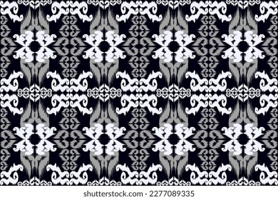 Fondo del patrón de quevron de los ikat étnicos Patrón tradicional sobre el tejido en Indonesia y otros países asiáticos.