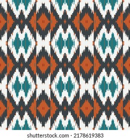 Ethnic Ikat Diamond pattern art. Seamless pattern in tribal, folk embroidery, and Mexican style. Aztec geometric art ornament print. Design for carpet, clothing, wrapping, fabric, cover, textile
