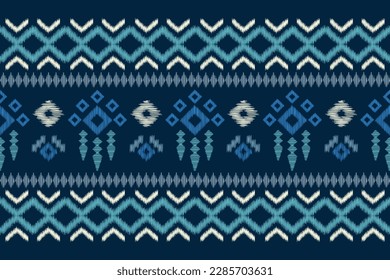 Ethnic Ikat fabric pattern geometric style.African Ikat embroidery Ethnic oriental pattern navy blue background. Abstract,vector,illustration.For texture,clothing,scarf,decoration,carpet.