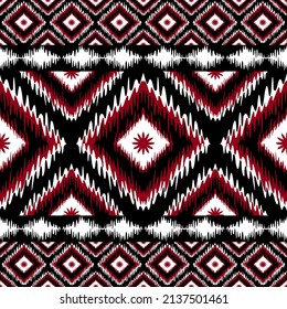 Ethnic Ikat Geometric oriental pattern on fabric in Indonesia and other Asian countries design for background and wallpaper. Seamless striped pattern in Aztec style. Folk embroidery.