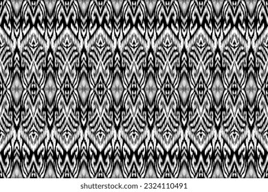 Patrón ininterrumpido de ikat étnico, estilo africano, vector abstracto, bordado de Chevron, bordado de Paisley, patrón aborigen navajo, motivos aztecos y tribales, patrón geométrico, estilo dibujado a mano vectorial.
