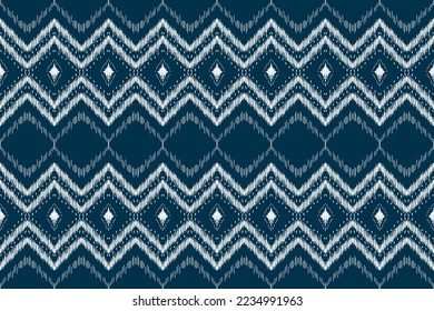 Patrón de ikat étnico sin fisuras en las tribus. Huella de ornamento étnico geométrico azteca. Estilo de patrón de Ikat. Diseño para fondo, papel pintado, ilustración, tela, ropa, alfombra, textil, batik, bordado.