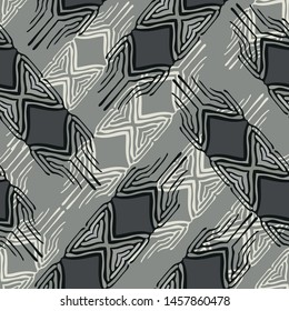 Ethnic inspired seamless vector pattern with rhombus shapes in metal grey shades.
