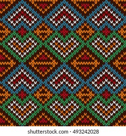 Ethnic knitting ornamental seamless vector pattern with perpendicular lines as a knitted fabric texture in blue, white, red, orange and green colors