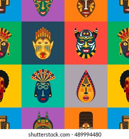 Ethnic masks in flat style seamless pattern. Background of african tribal masks.