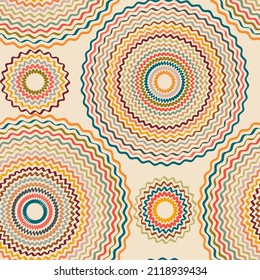 Ethnic ornament consisting of multi-colored zigzag circles on a beige background.