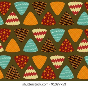 ethnic ornament - Triangles on a green background. Seamless vector