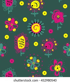Ethnic ornamental flowers in green, purple, yellow, black a seamless pattern on a dark green background.