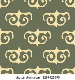 Ethnic pattern on a green background. Seamless.