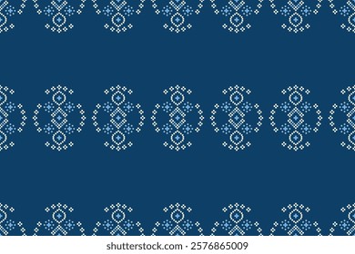 Ethnic pattern traditional motif ikat geometric fabric pattern cross stitch.Ikat embroidery Ethnic oriental Pixel blue background.Abstract,vector,illustration. Texture,decoration,wallpaper.