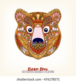 Ethnic patterned ornate hand drawn head of brown bear. Sketch for tattoo, poster, print or t-shirt. Vector illustration.