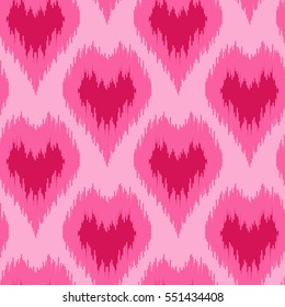 Ethnic pink seamless pattern with hearts. Boho abstract textile print. Romantic wallpaper.