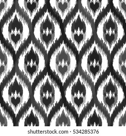Ethnic seamless grayscale pattern. Boho textile print. Geometric wallpaper with abstract tile and elements.