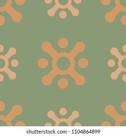 Ethnic seamless pattern with abstract orange elements on green background