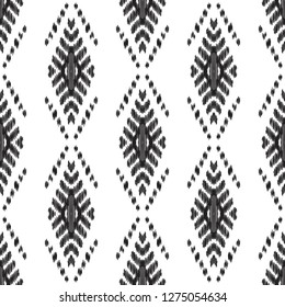 Ethnic seamless pattern. Boho ikat ornament. Can be used for textile, wallpaper, wrapping paper, greeting card background, phone case print. Black and white vector illustration. Tribal graphic design.